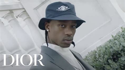 Travis Scott models the Air Dior line 